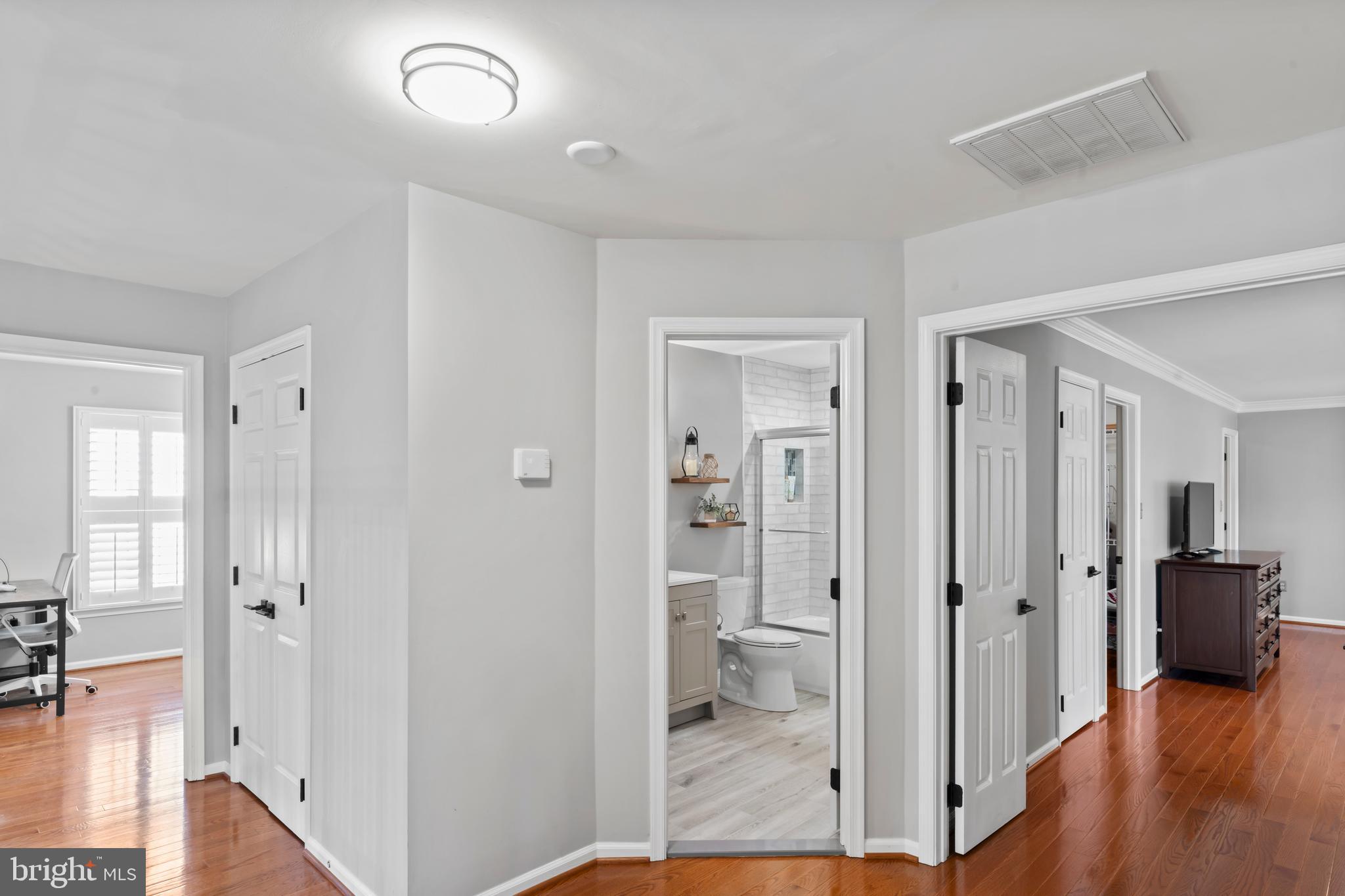 2519 Fallon Drive Herndon, VA 20171 - Photo 44 of 107 a view of a hallway with bathroom and wooden floor