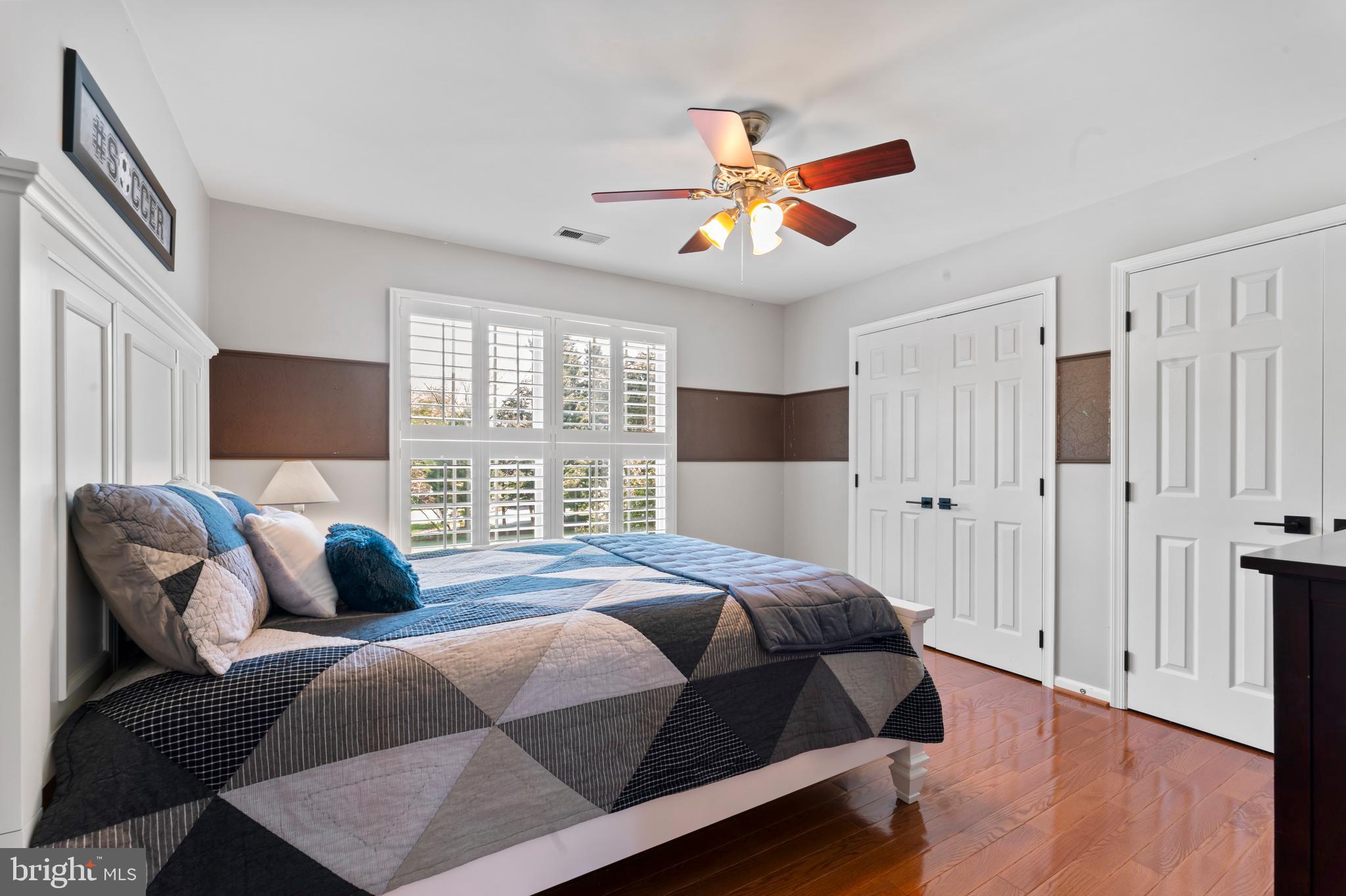 2519 Fallon Drive Herndon, VA 20171 - Photo 47 of 107 a bedroom with a bed a couch and a chandelier