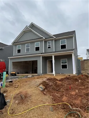 a front view of a house with yard