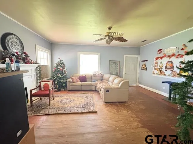 a living room with furniture or couch and a chandelier