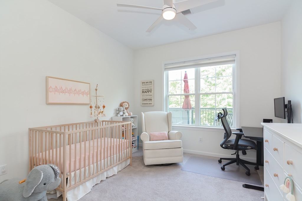 200 Revere Street, Unit 4108 Canton, MA 02021 - Photo 19 of 33 a bedroom with a bed and a window