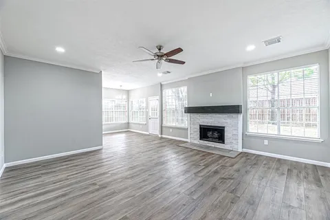 a view of a room window and wooden floor