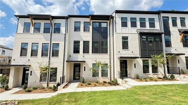a view of a building with a yard