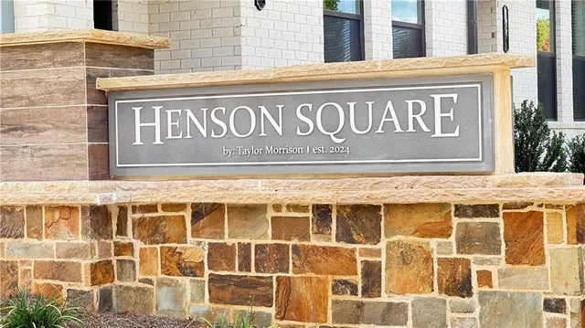 a sign on a wall next to a building