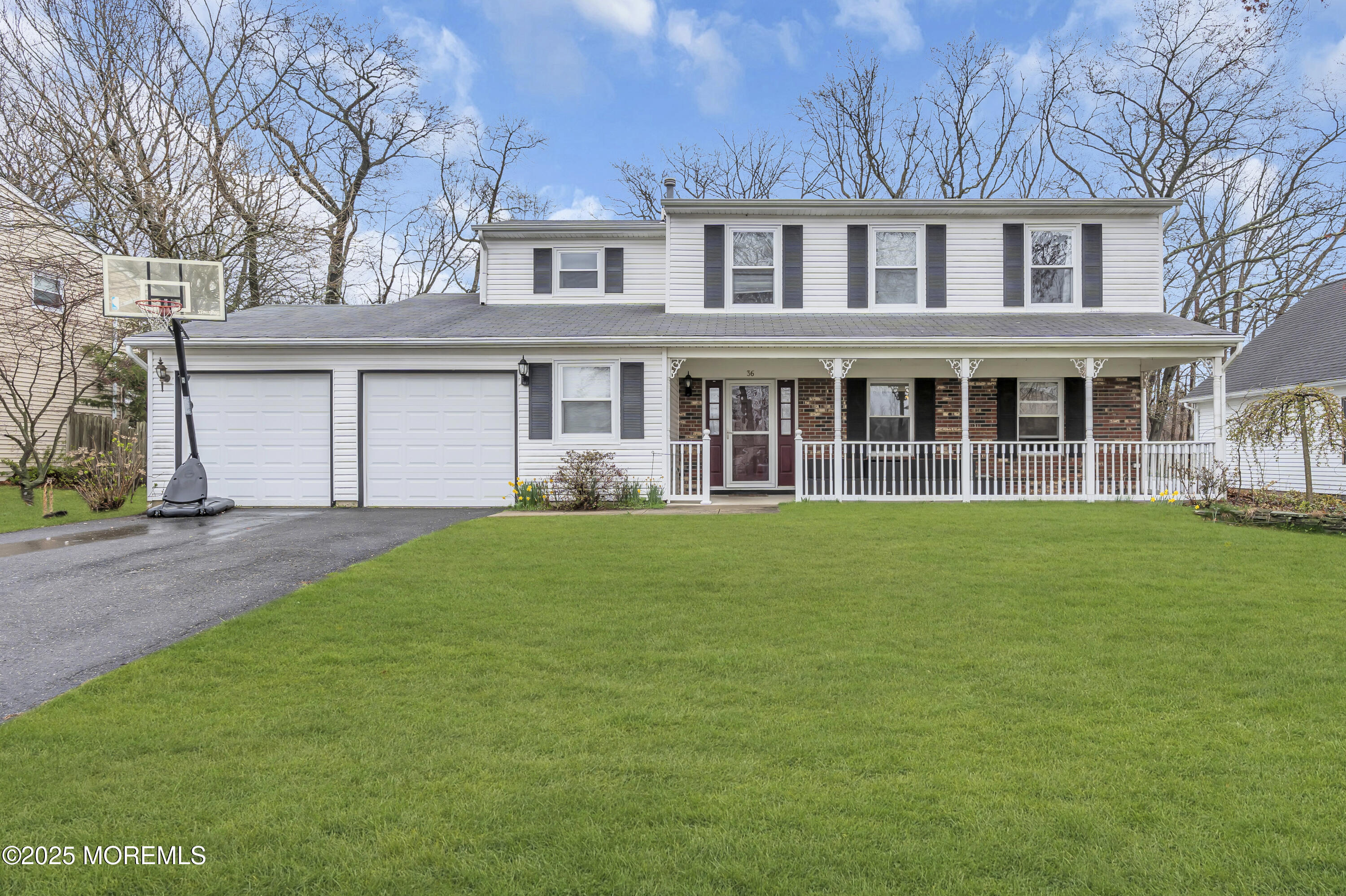 front view of a house with a garden
