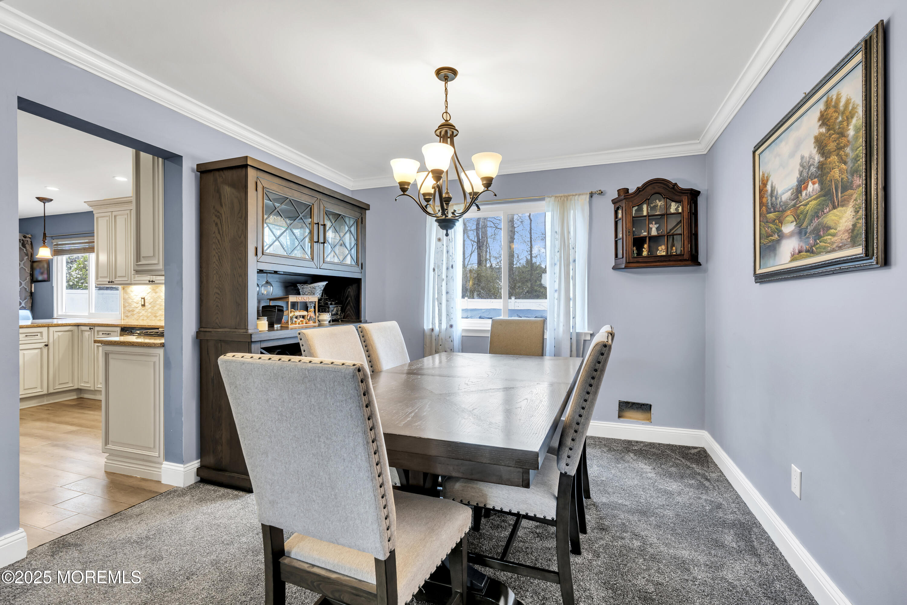 36 Appletree Road Howell, NJ 07731 - Photo 14 of 38 a view of a dining room with furniture a chandelier and wooden floor