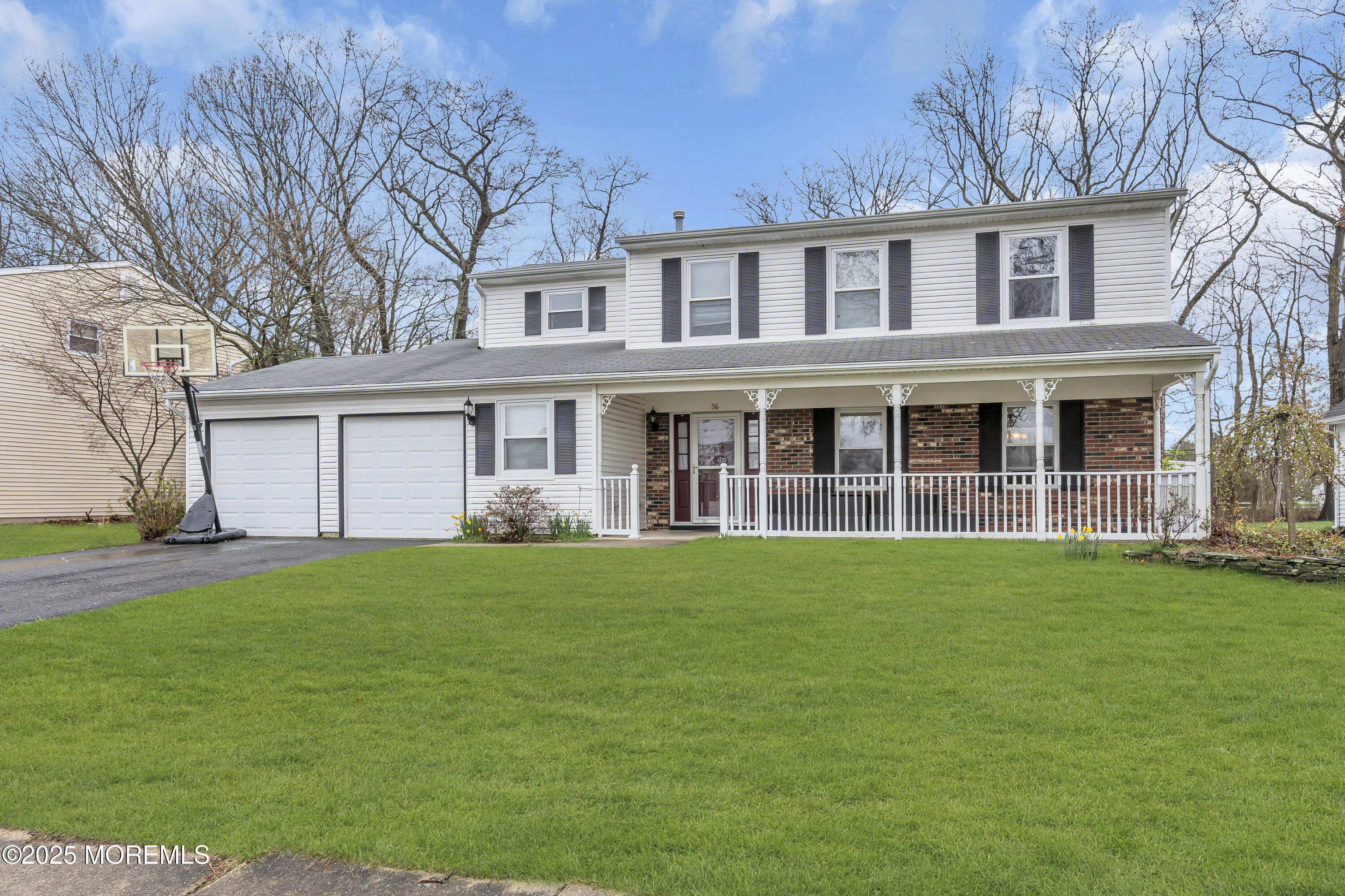 36 Appletree Road Howell, NJ 07731 - Photo 2 of 38 a front view of a house with a garden