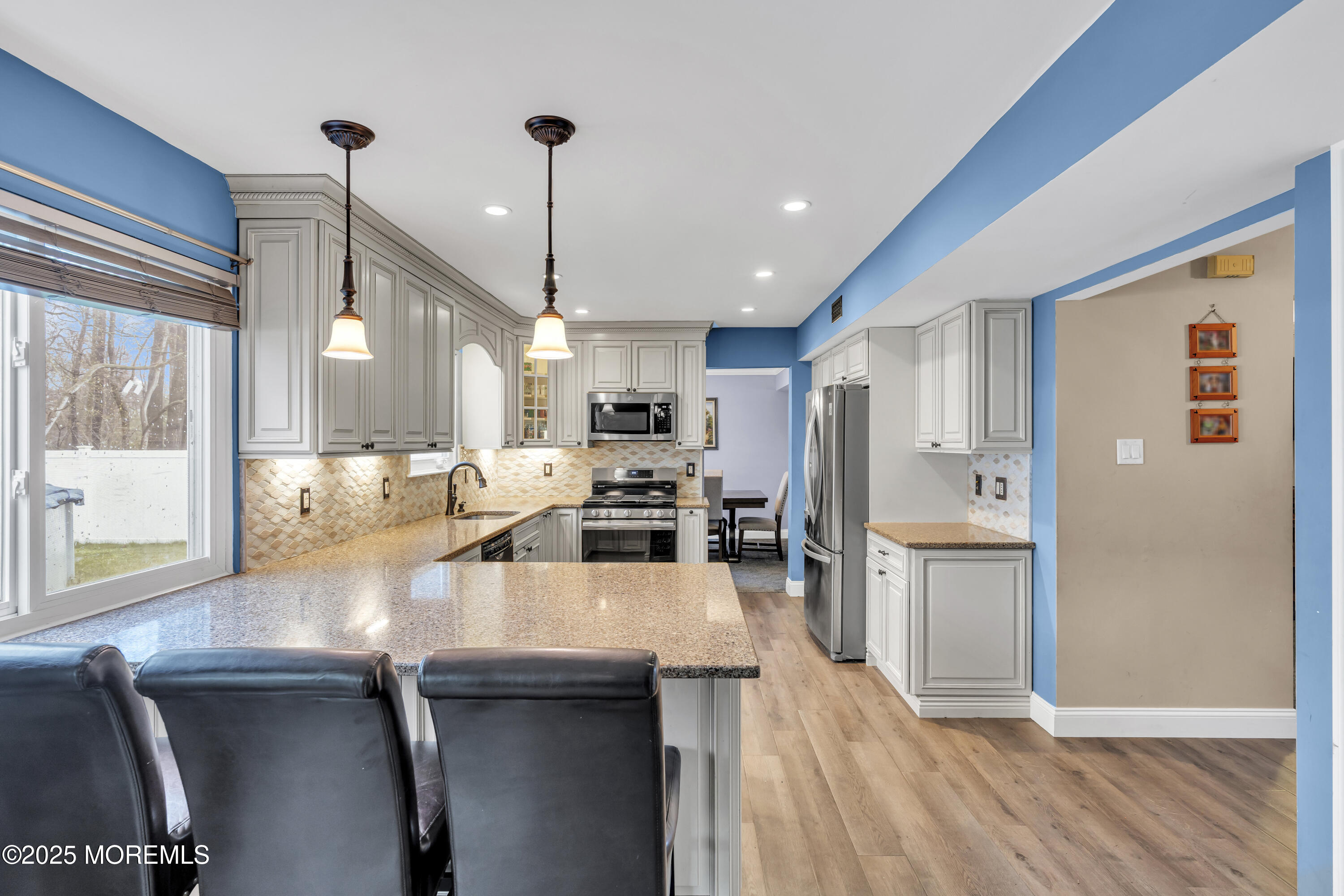 36 Appletree Road Howell, NJ 07731 - Photo 24 of 38 a kitchen with a sink a counter top space stainless steel appliances and cabinets