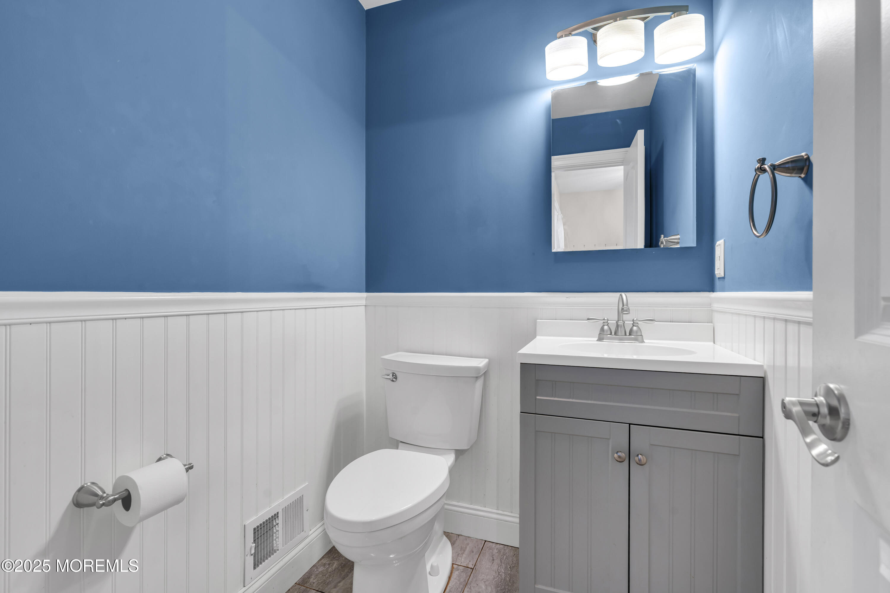 36 Appletree Road Howell, NJ 07731 - Photo 25 of 38 a bathroom with a sink a toilet and mirror