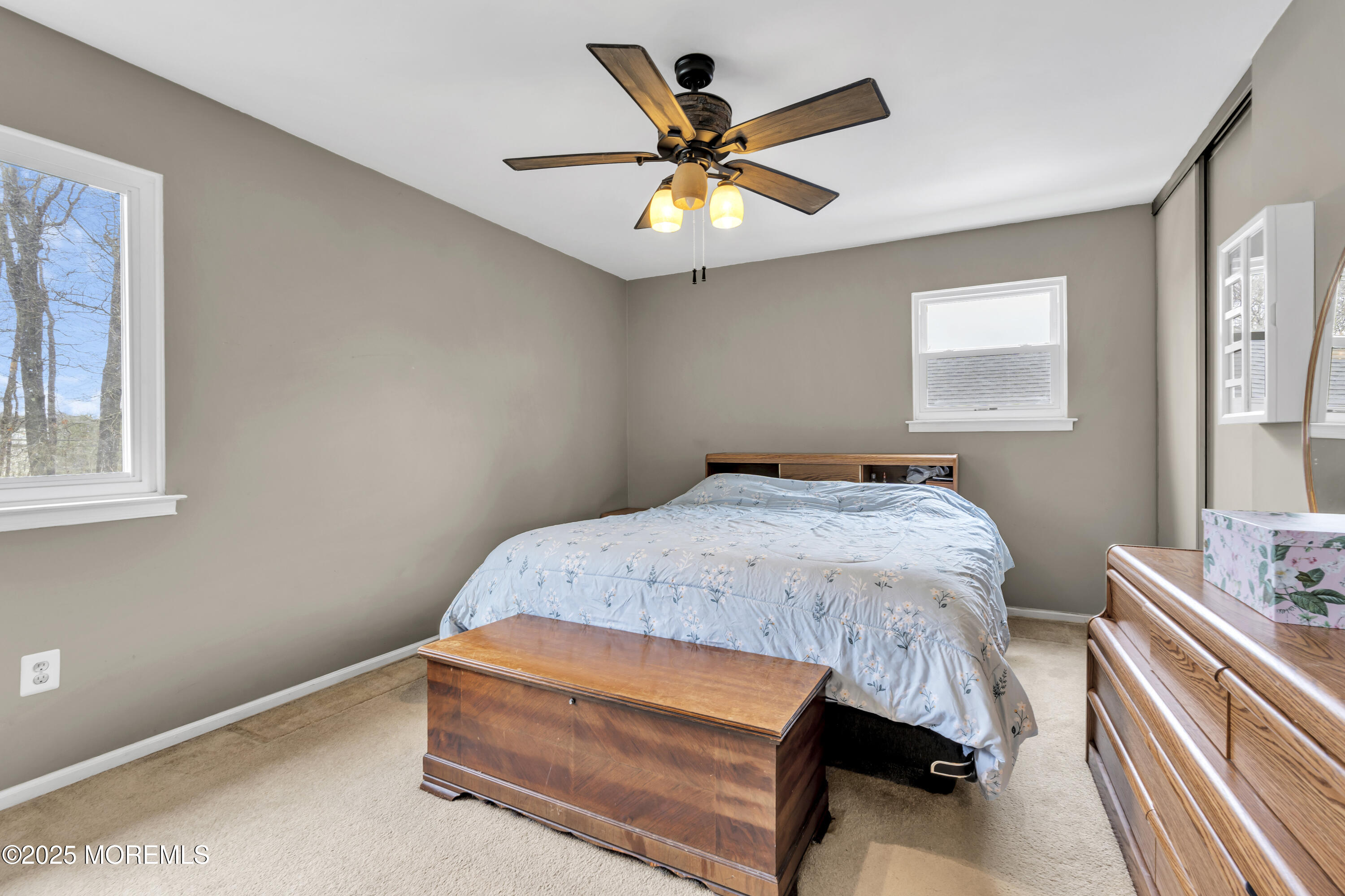 36 Appletree Road Howell, NJ 07731 - Photo 26 of 38 a bedroom with a bed and a chandelier