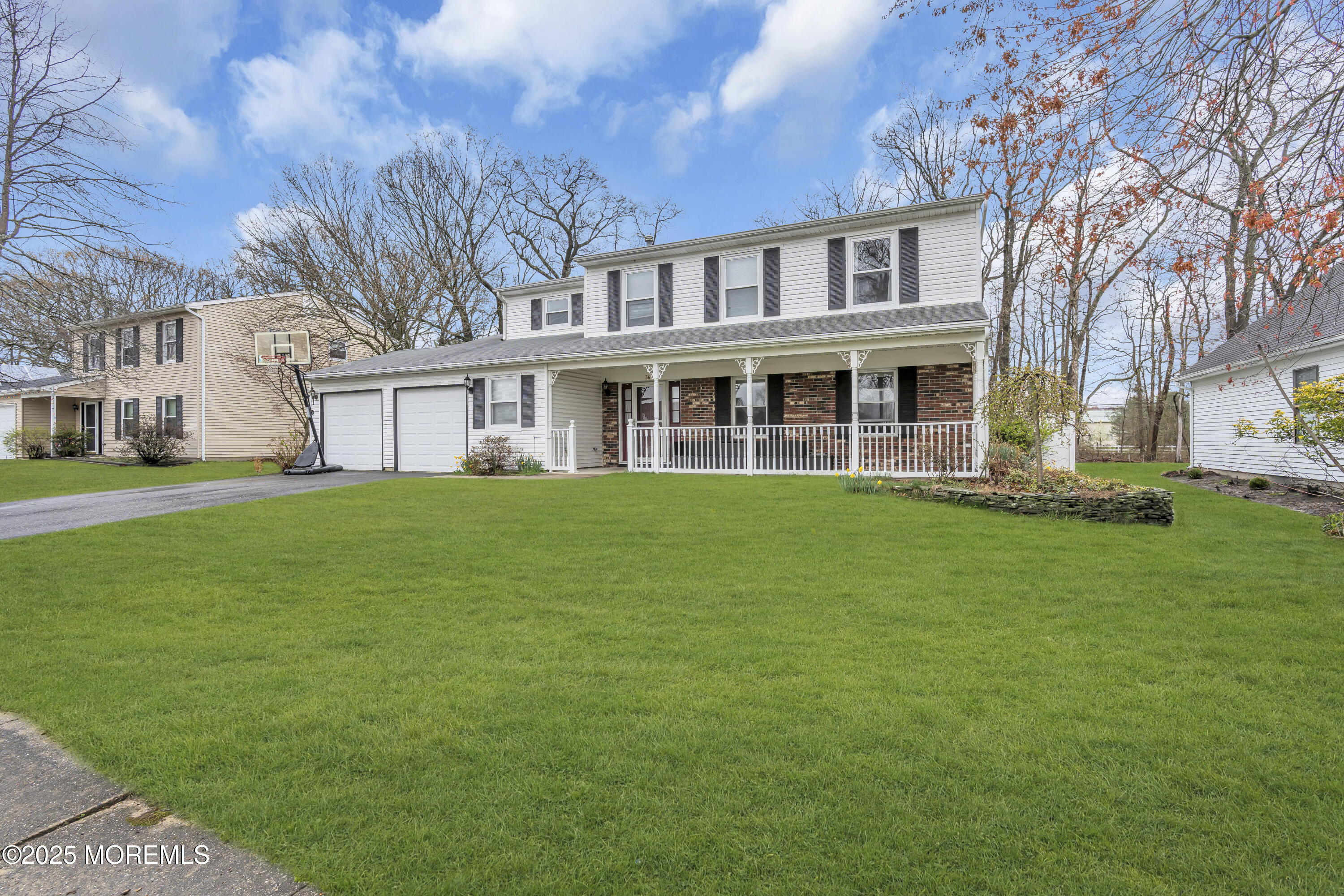 36 Appletree Road Howell, NJ 07731 - Photo 3 of 38 a front view of a house with a garden