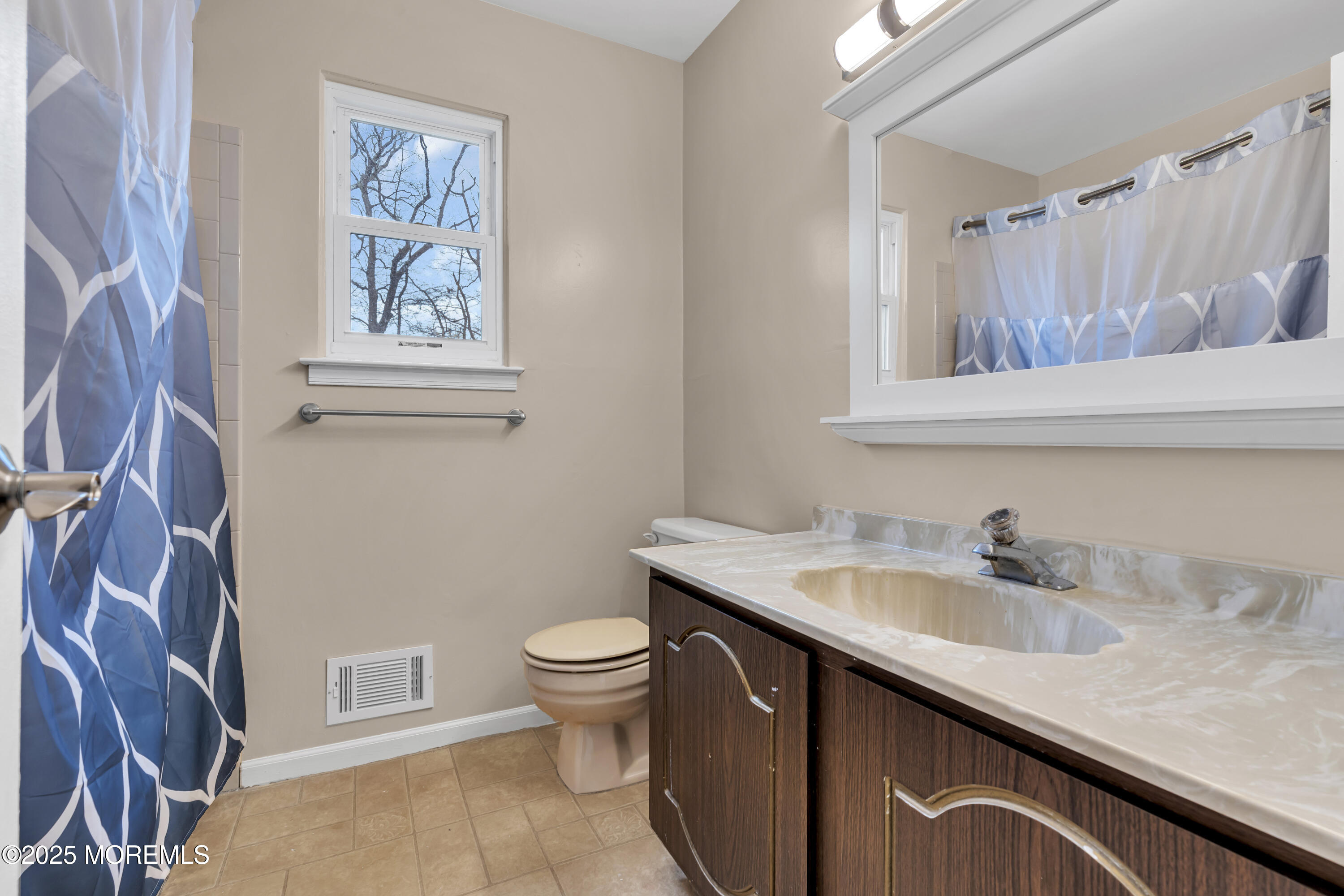 36 Appletree Road Howell, NJ 07731 - Photo 32 of 38 a bathroom with a sink and a mirror