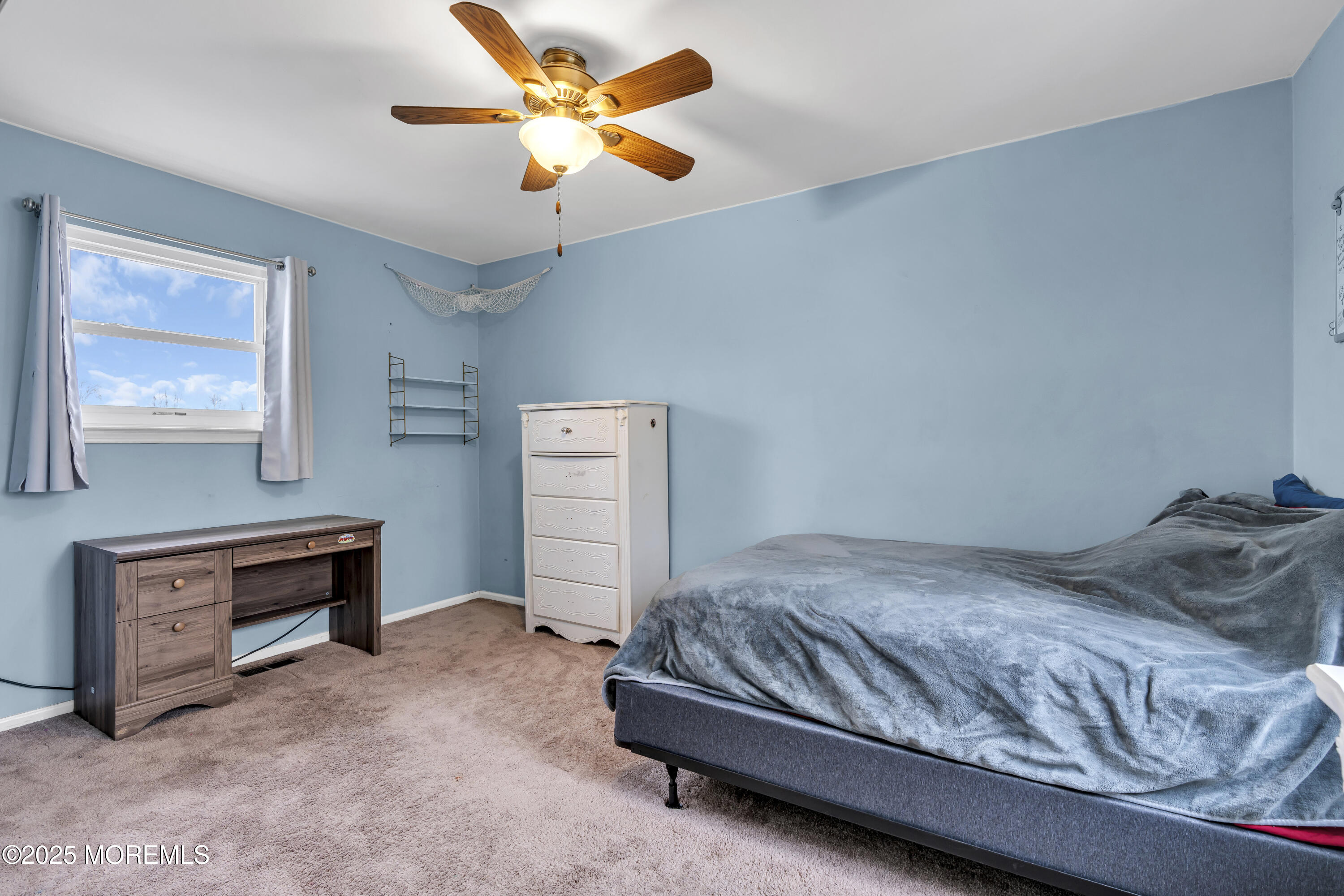 36 Appletree Road Howell, NJ 07731 - Photo 33 of 38 a bedroom with a bed and a chandelier