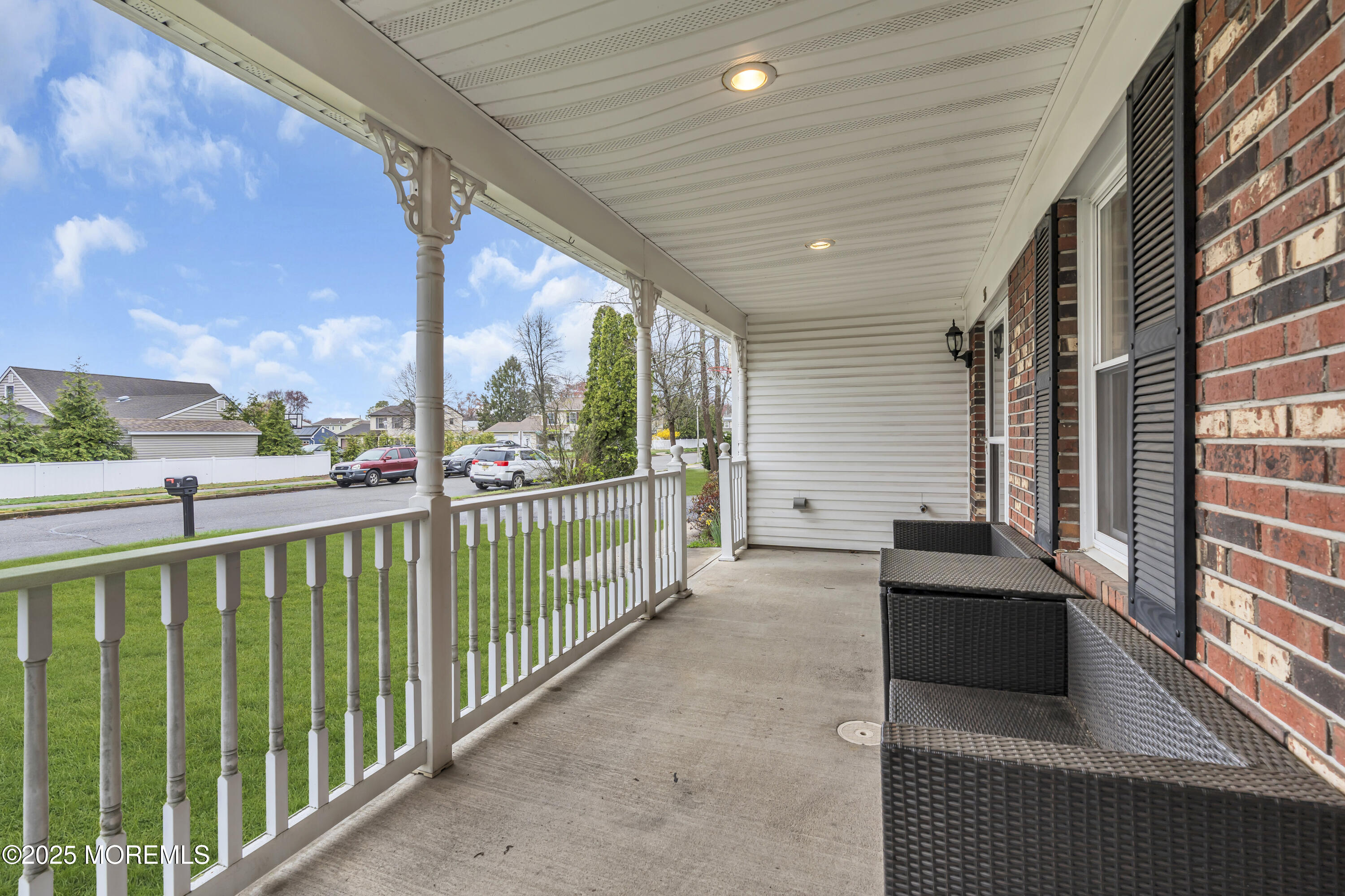 36 Appletree Road Howell, NJ 07731 - Photo 5 of 38 a view of a balcony with couches and wooden floor