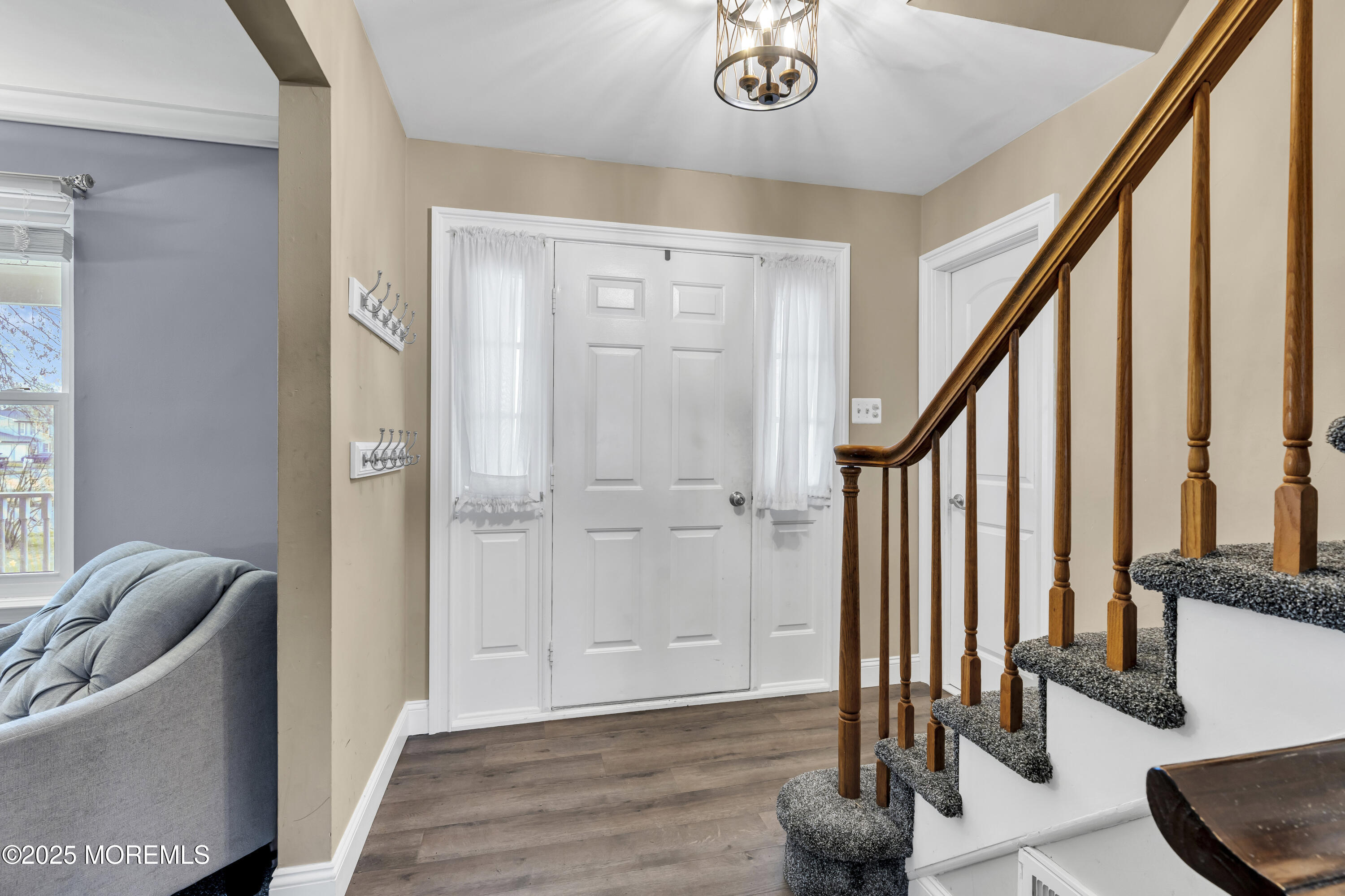 36 Appletree Road Howell, NJ 07731 - Photo 7 of 38 a view of an entryway with wooden floor and stairs
