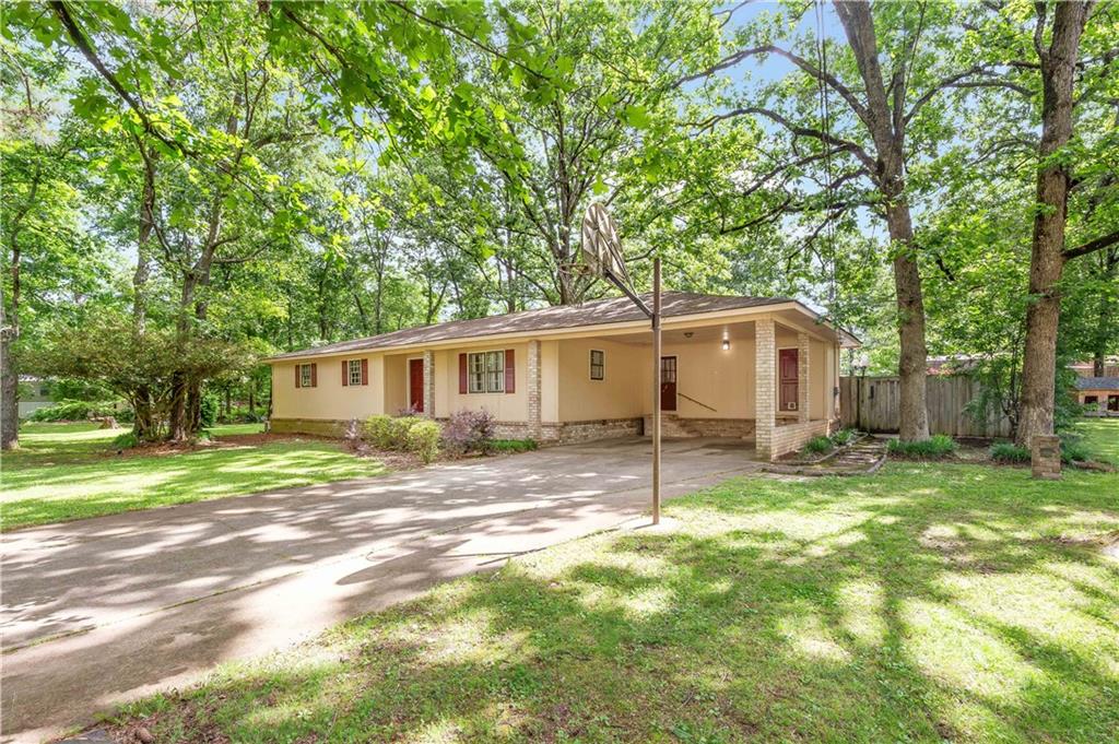 19 Polaris Terrace Northwest Rome, GA 30165 - Photo 1 of 1 a view of a yard with a house and a large tree
