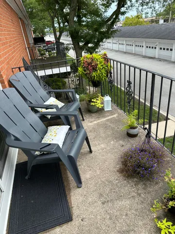 a vase of flowers sitting on a floor