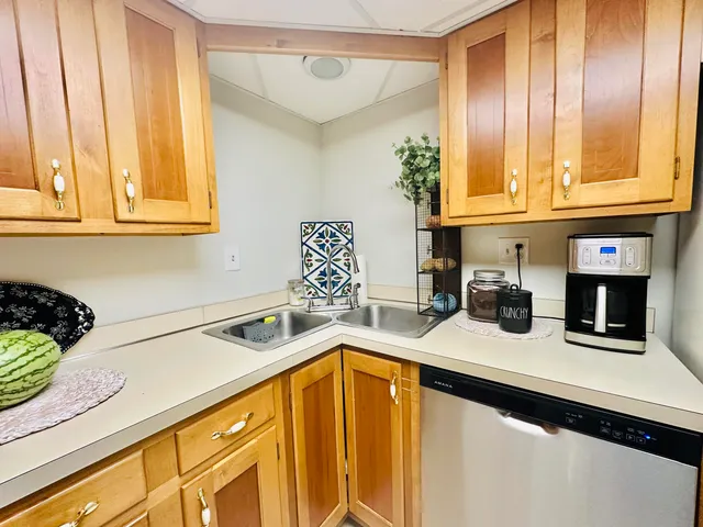 a kitchen with a sink and cabinets