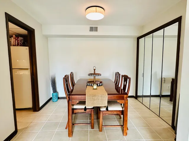 a view of a dining room with furniture window and outside view