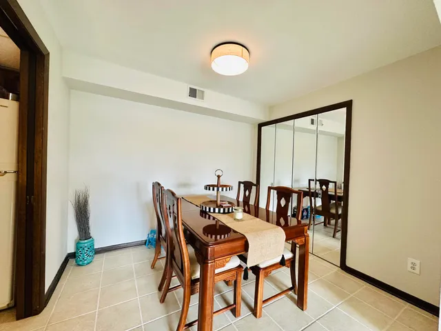a view of a dining room with furniture and window