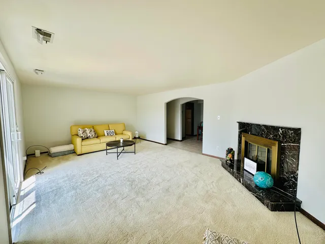 a living room with furniture and a table