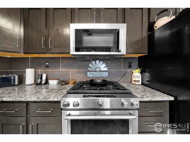 a bedroom with bed and wooden floor