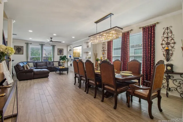 a living room with furniture a table and chairs
