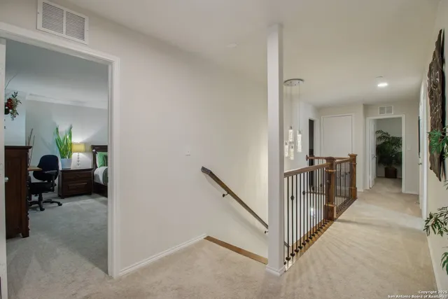 a view of a hallway with livingroom