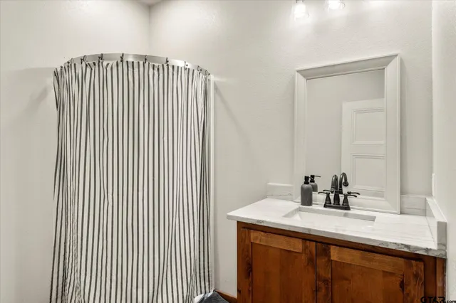 a bedroom with a bed a desk and chair