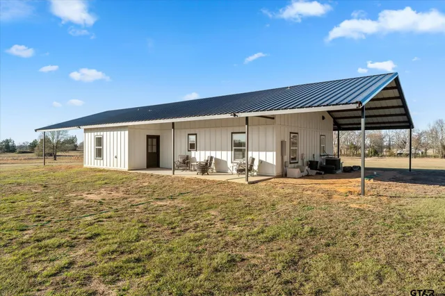 a view of swimming pool with outdoor seating