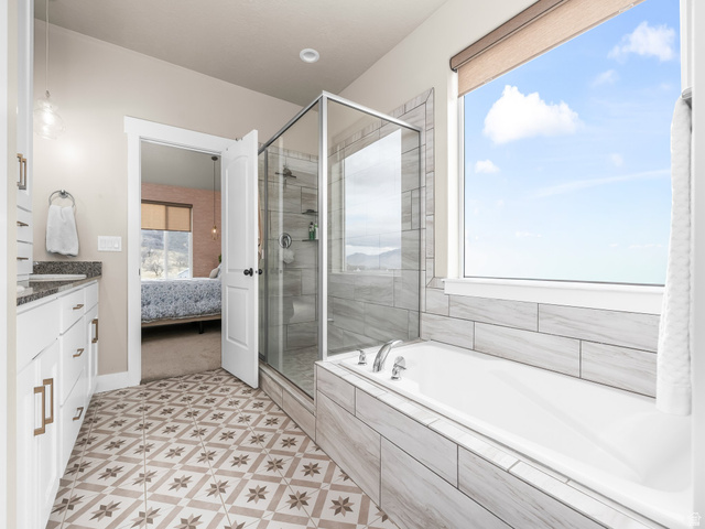 102 Elk Ridge Drive Elk Ridge, UT 84651 - Photo 18 of 61 Primary en-suite featuring separate shower and soaker tub.