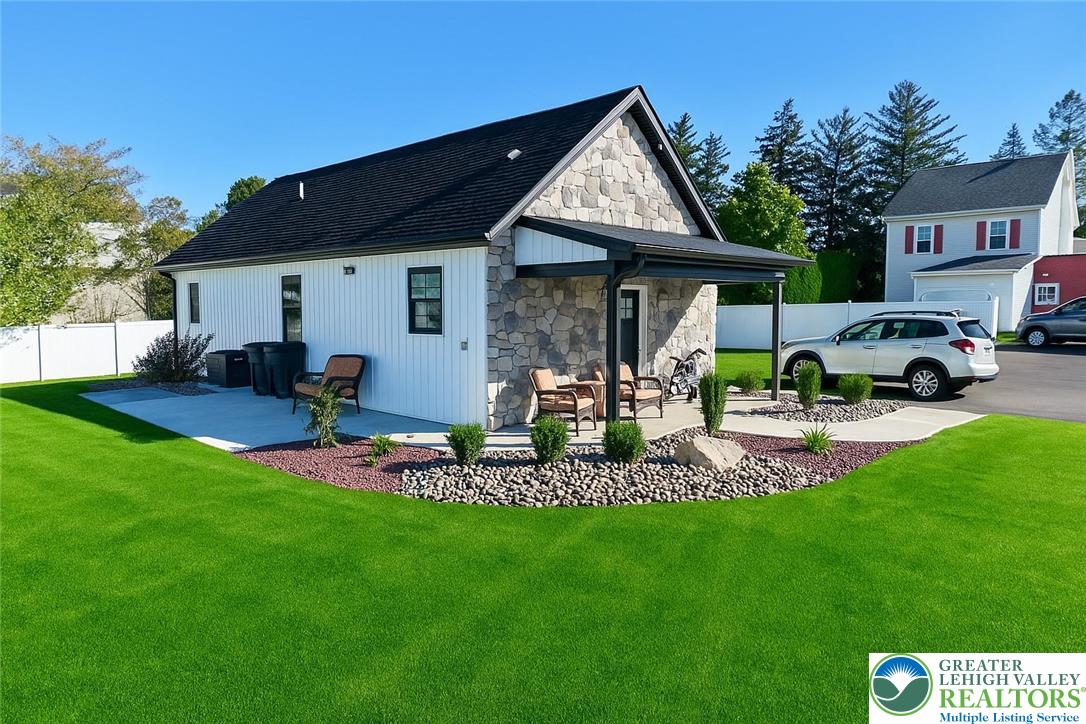 1425 Howertown Road, Unit B Catasauqua, PA 18032 - Photo 2 of 30 a front view of a house with garden and trees