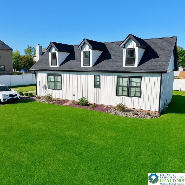 1425 Howertown Road, Unit B Catasauqua, PA 18032 - Photo 3 of 30 a front view of a house with a yard and trees