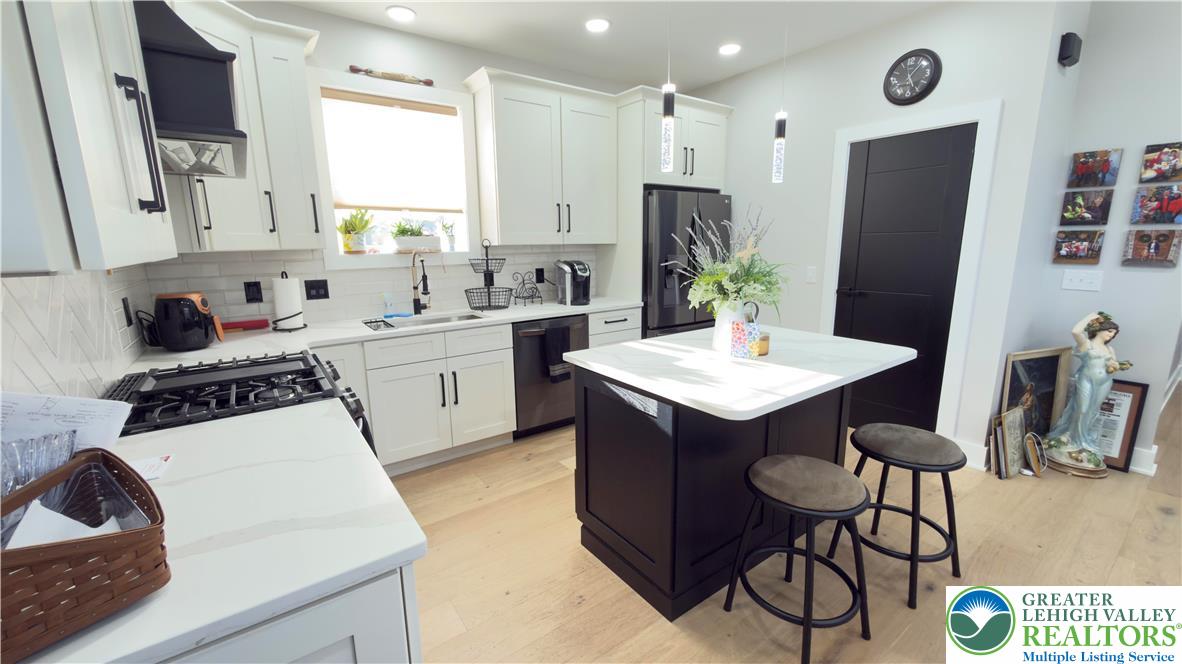 1425 Howertown Road, Unit B Catasauqua, PA 18032 - Photo 6 of 30 a kitchen with a sink stove and refrigerator