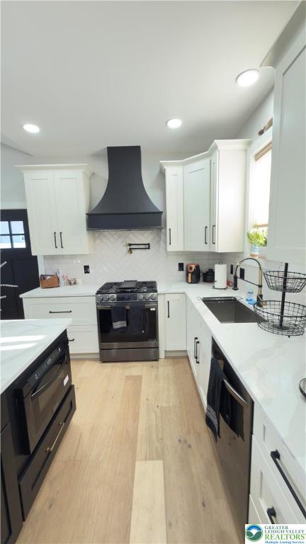 1425 Howertown Road, Unit B Catasauqua, PA 18032 - Photo 8 of 30 a large kitchen with stainless steel appliances a stove a sink a microwave a center island and cabinets