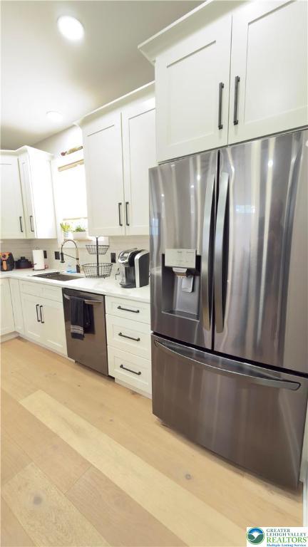 1425 Howertown Road, Unit B Catasauqua, PA 18032 - Photo 10 of 30 a kitchen with stainless steel appliances a refrigerator sink and cabinets