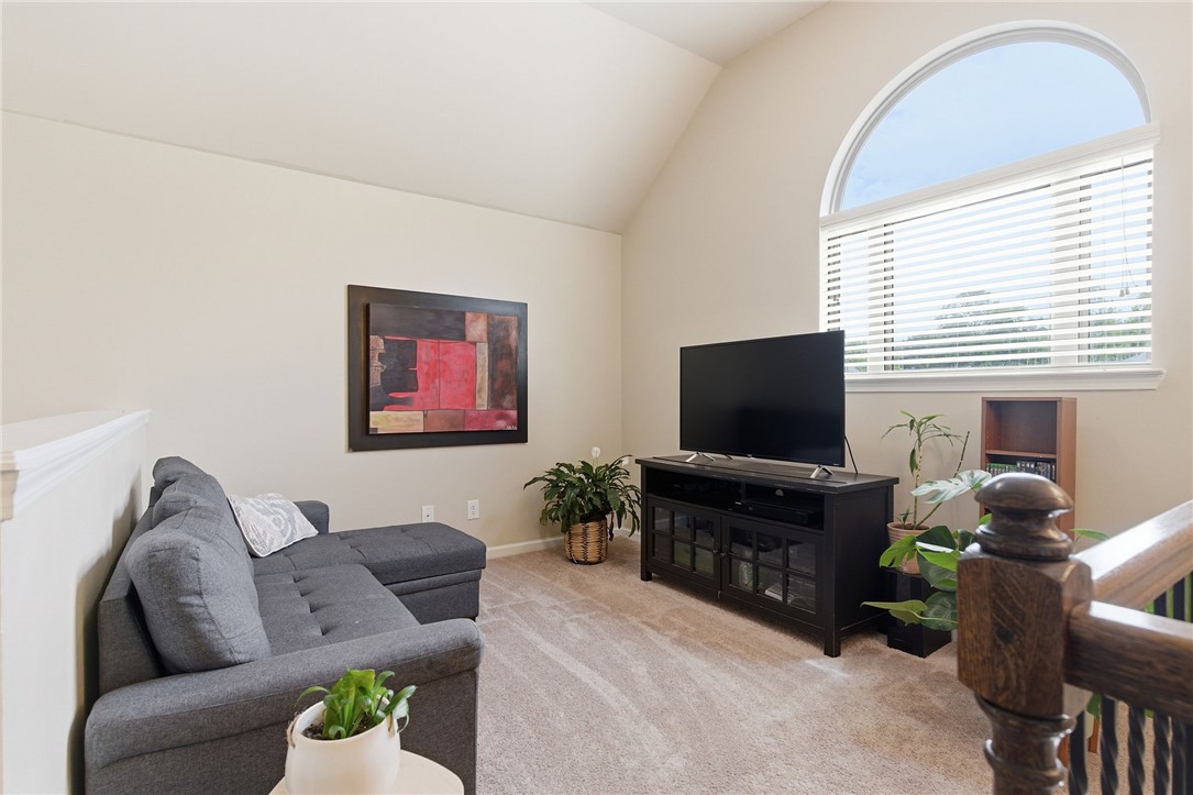 138 Buckland Drive Anderson, SC 29621 - Photo 28 of 49 This versatile loft area features an arched window and plush carpeting, ideal for flexible living.