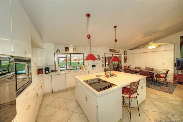 a kitchen that has a stove and a table