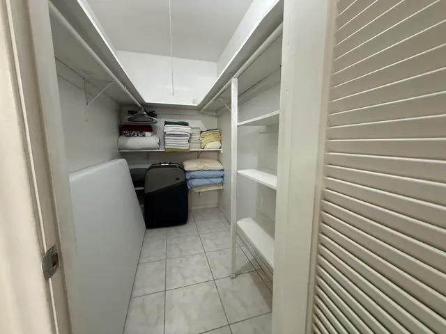 a kitchen with cabinets and a stove