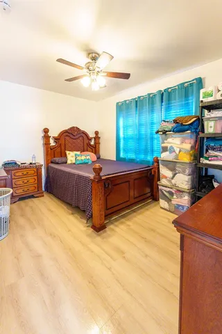 a bedroom with furniture and a chandelier