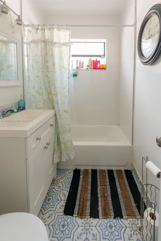 a bathroom with a sink and a shower
