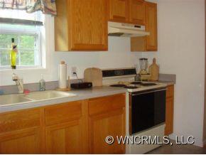 366 Baber Road Rutherfordton, NC 28139 - Photo 7 of 11 a kitchen with a sink and a stove top oven