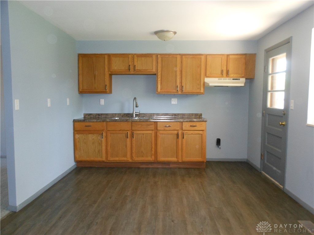 143 West Emerick Road West Milton, OH 45383 - Photo 8 of 37 This kitchen features a practical layout with ample cabinetry and durable flooring.