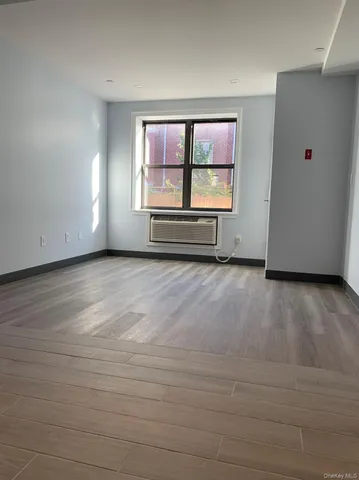 a view of an empty room with a window