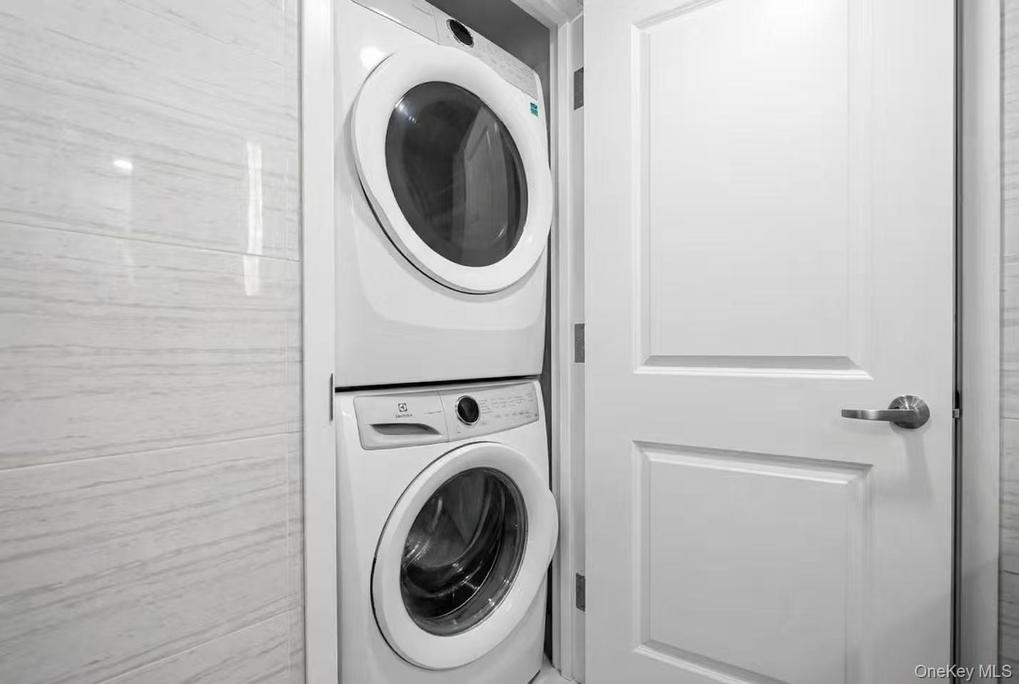 34-17 103rd Street, Unit 103 P6 Queens, NY 11368 - Photo 8 of 10 a utility room with dryer and washer