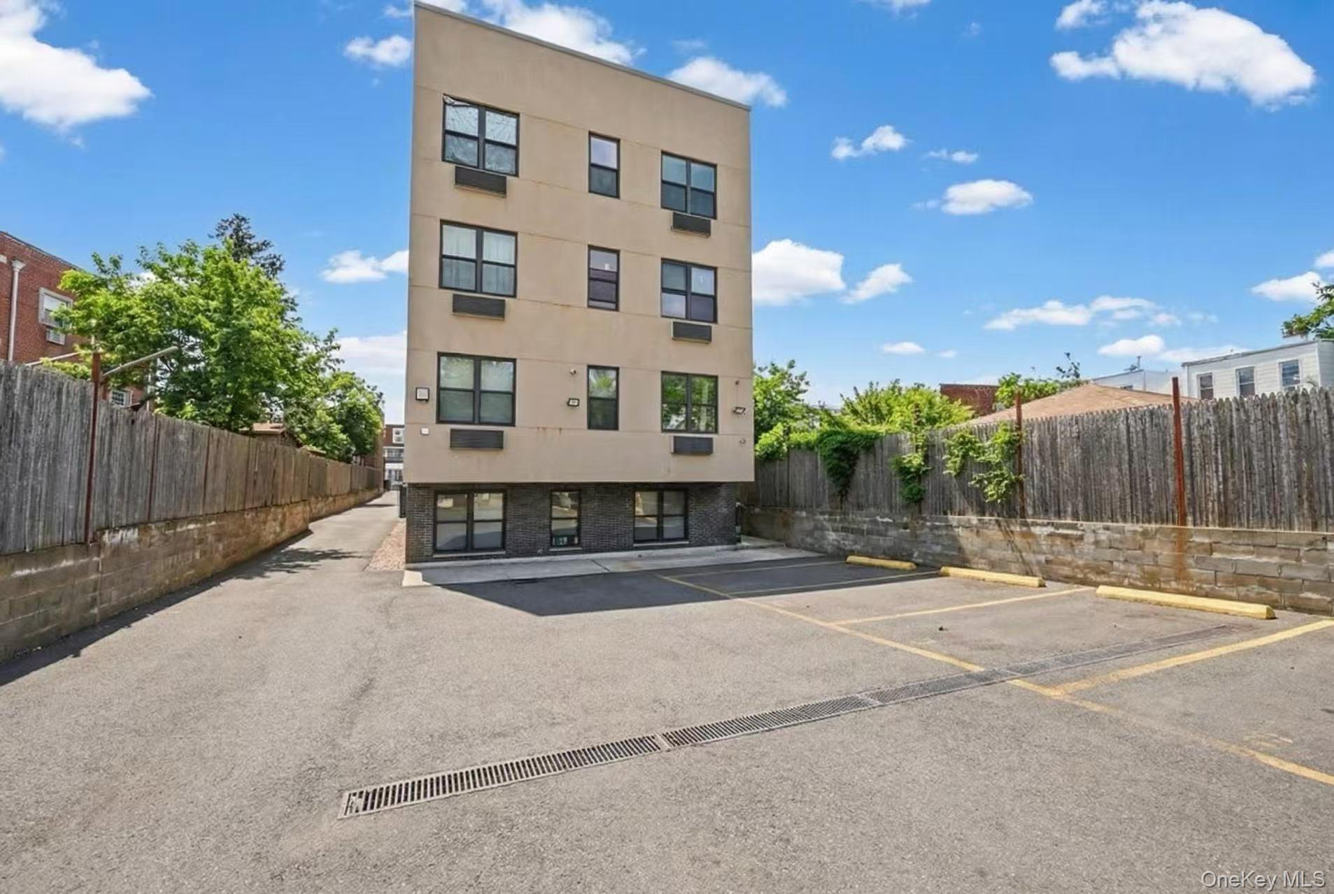34-17 103rd Street, Unit 103 P6 Queens, NY 11368 - Photo 9 of 10 a building with trees in front of it