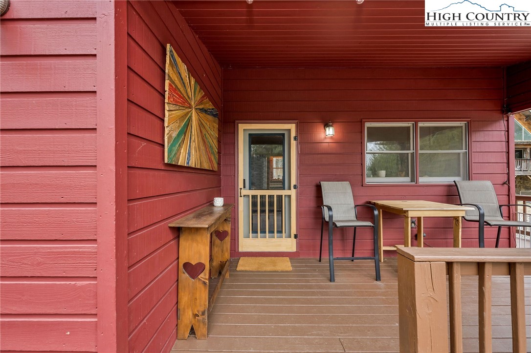 508 Curly Q Drive Crumpler, NC 28617 - Photo 6 of 39 a view of a patio with table and chairs
