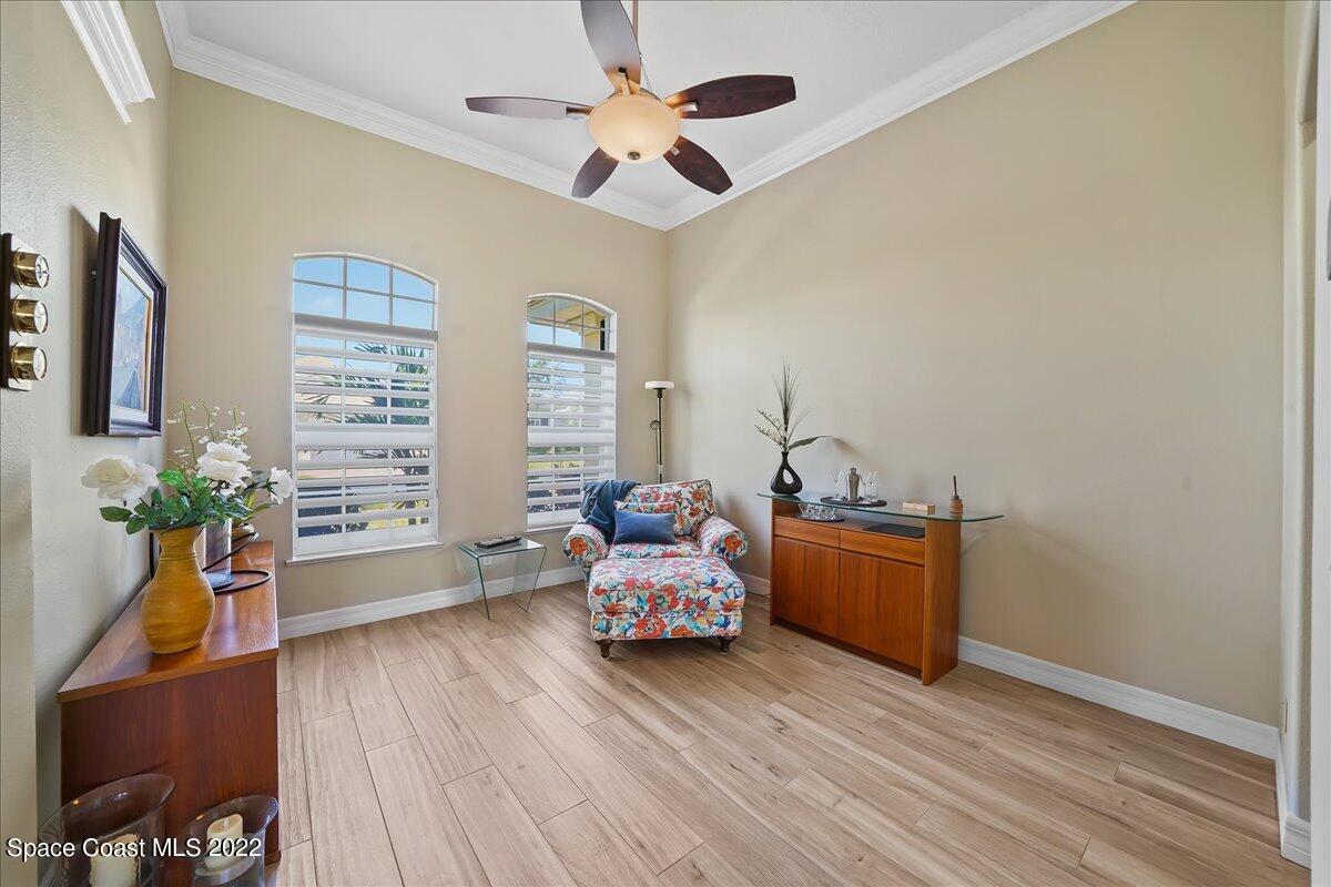 245 Clyde Street Melbourne Beach, FL 32951 - Photo 15 of 47 a bedroom with furniture and a window