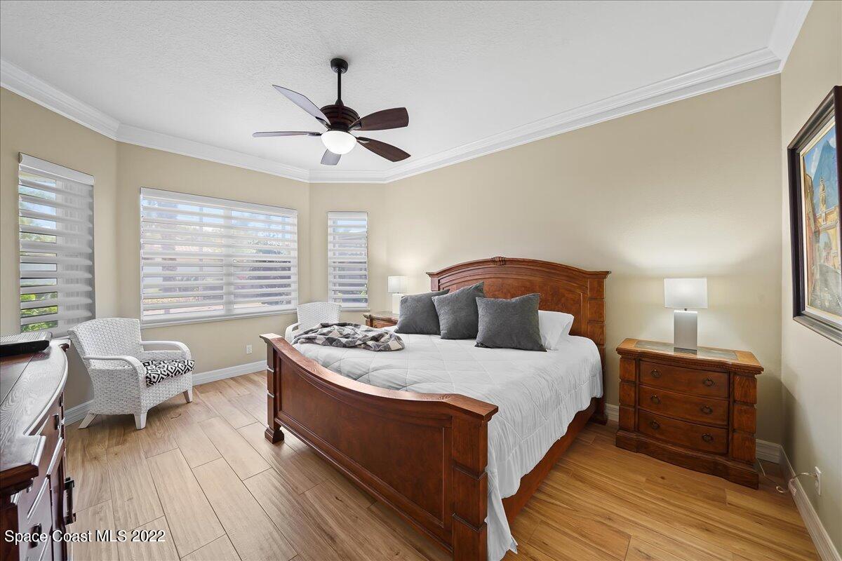 245 Clyde Street Melbourne Beach, FL 32951 - Photo 22 of 47 a bedroom with bed and window