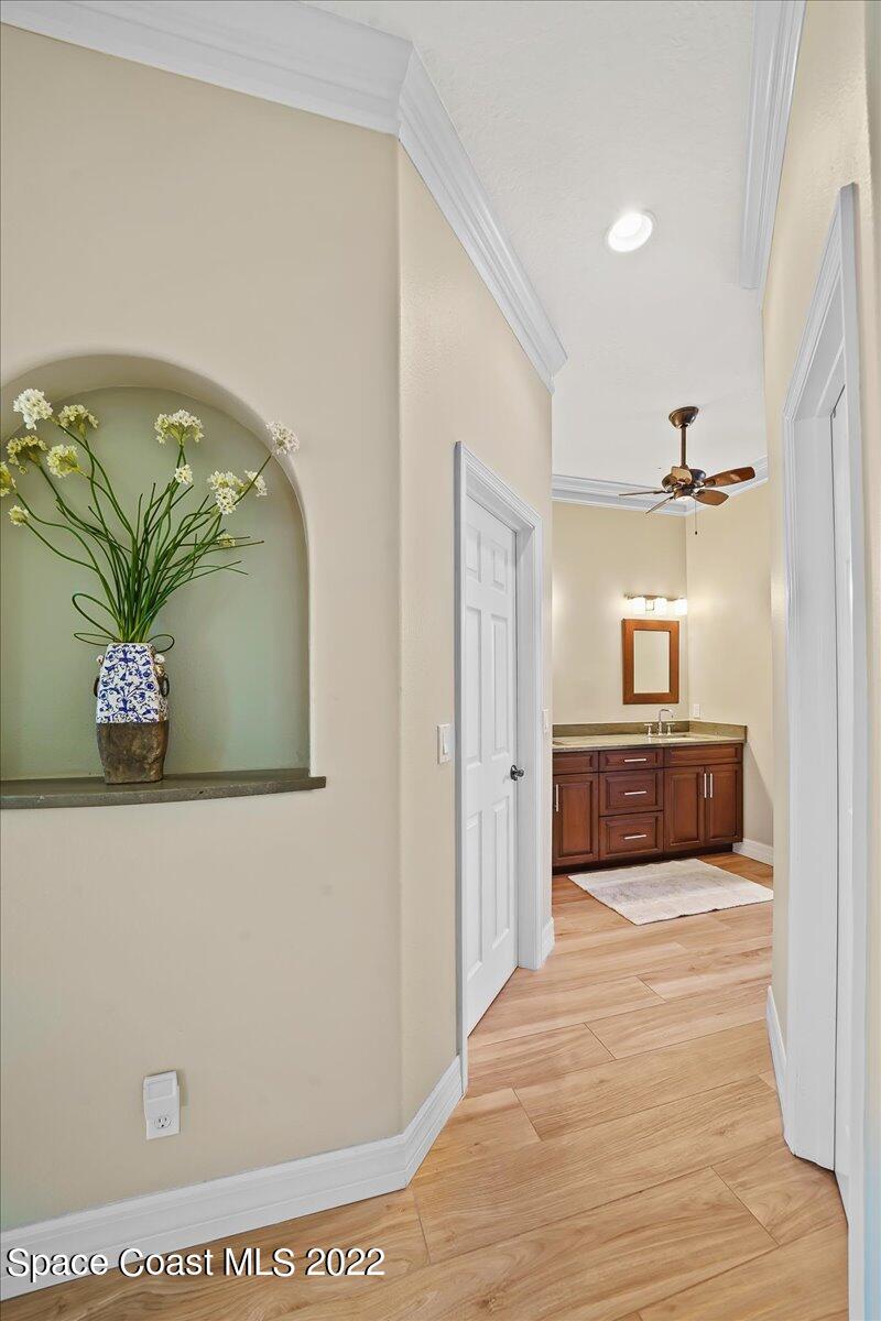 245 Clyde Street Melbourne Beach, FL 32951 - Photo 24 of 47 a bedroom with a bed and a painting on the wall